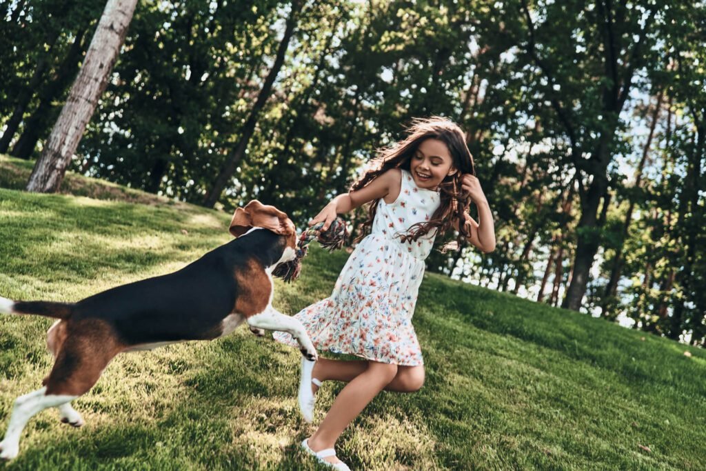  Little girl playing with her dog 